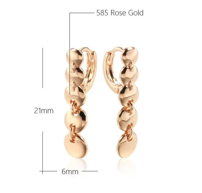 Gold tone retro long circle earrings with woven texture on a copper base.