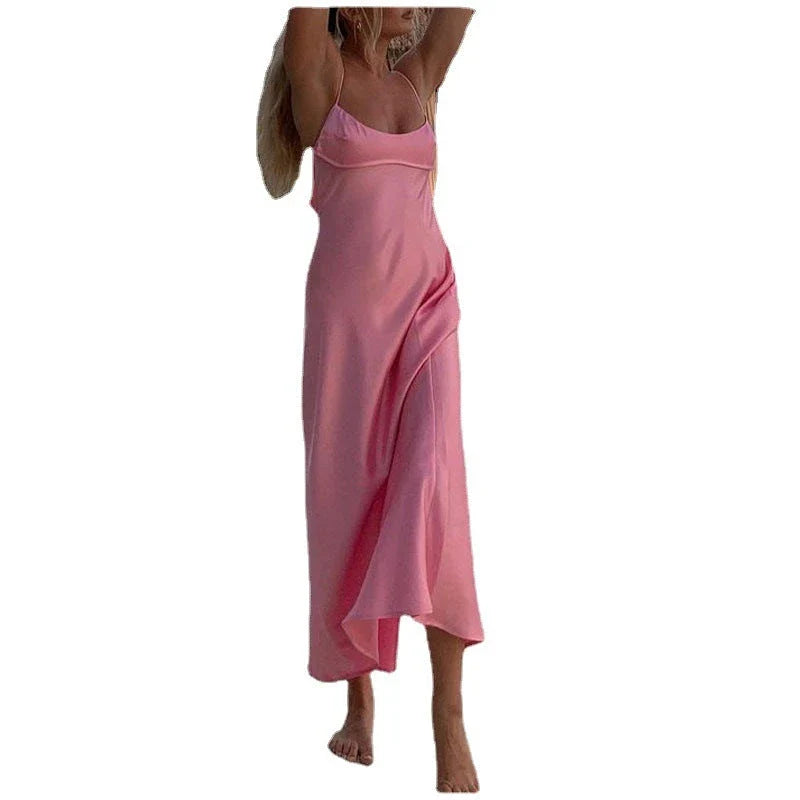 Elegant sleeveless slip maxi dress in pink with backless design and figure-flattering silhouette