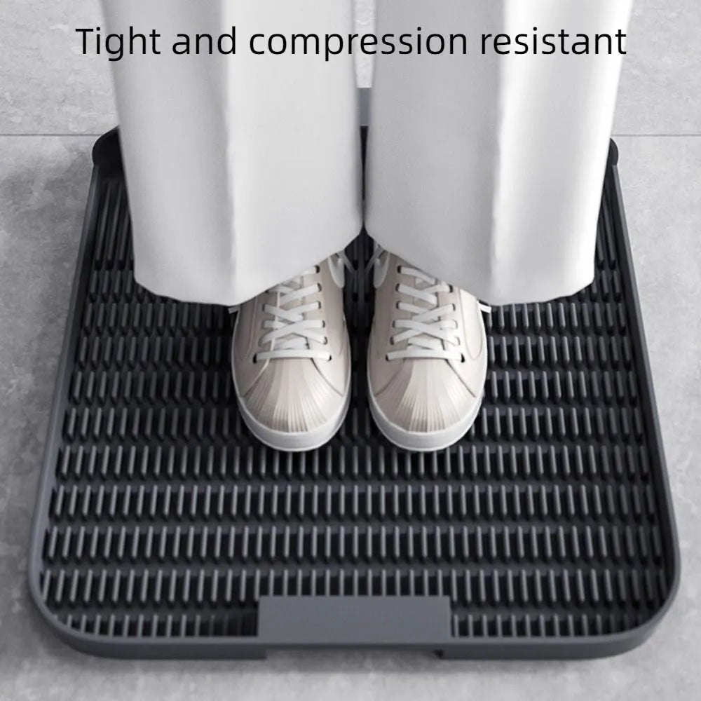 Large black cat litter pedal mat with slanted mouth design and textured surface