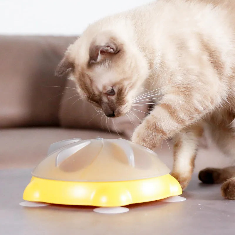 Yellow plastic interactive cat puzzle feeder toy with compartments for treats