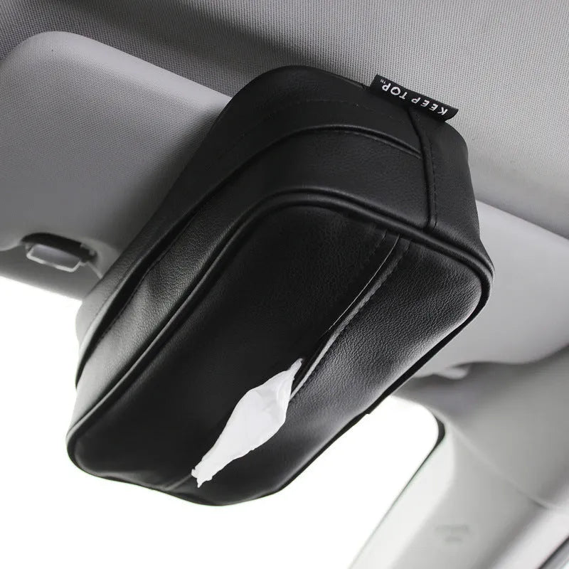 Black PU leather hanging storage box with paper bag design, shown suspended.