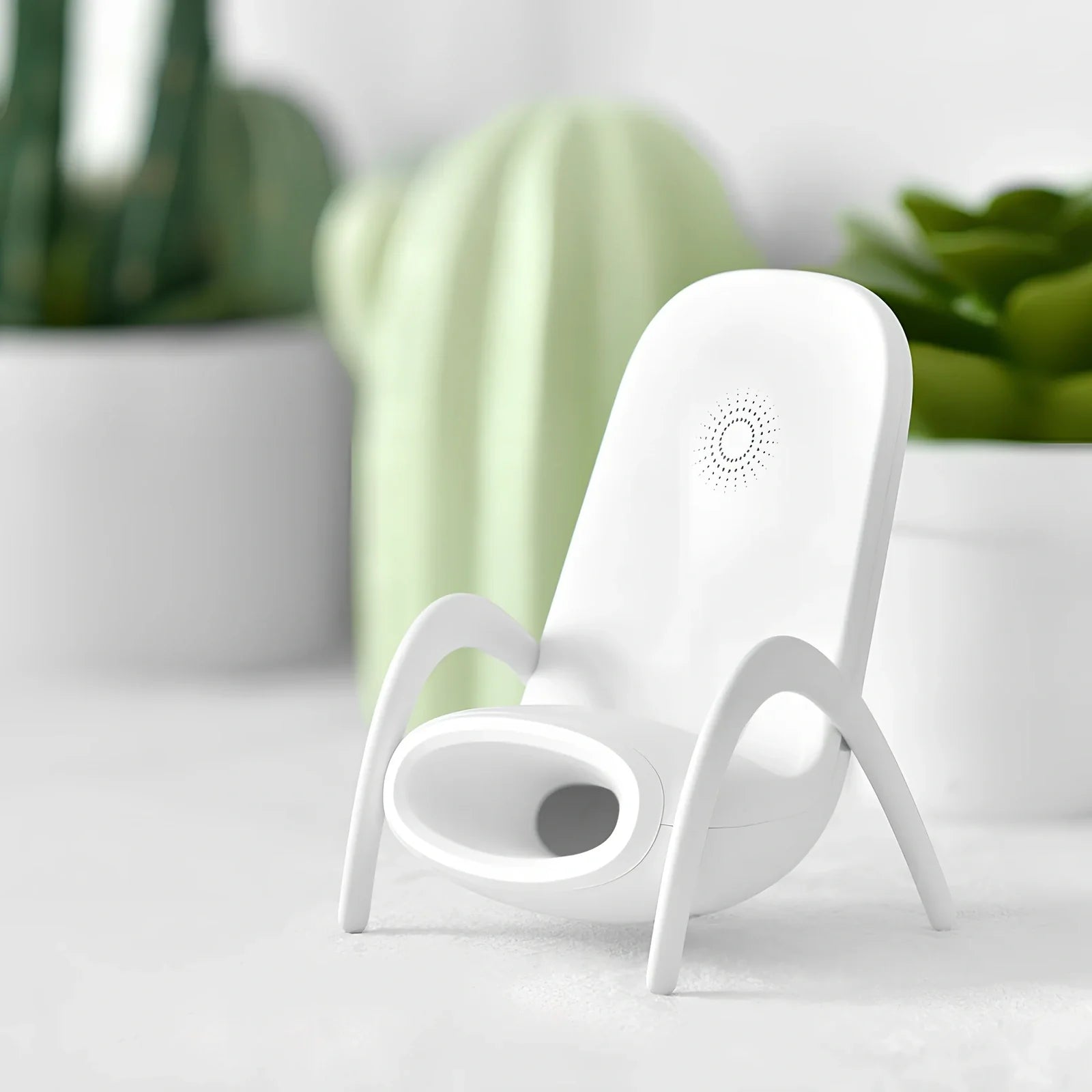 Black amplified wireless charger with bracket, 9.8 x 9.8 x 14.2 cm, for phone charging and audio boost