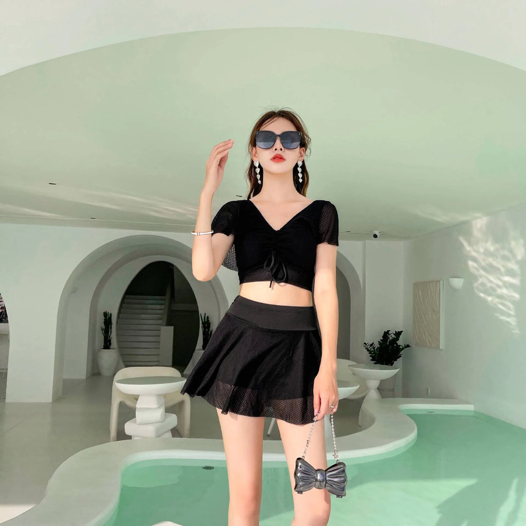 Women's two-piece skirt swimsuit in solid colour with separate top and skirt components