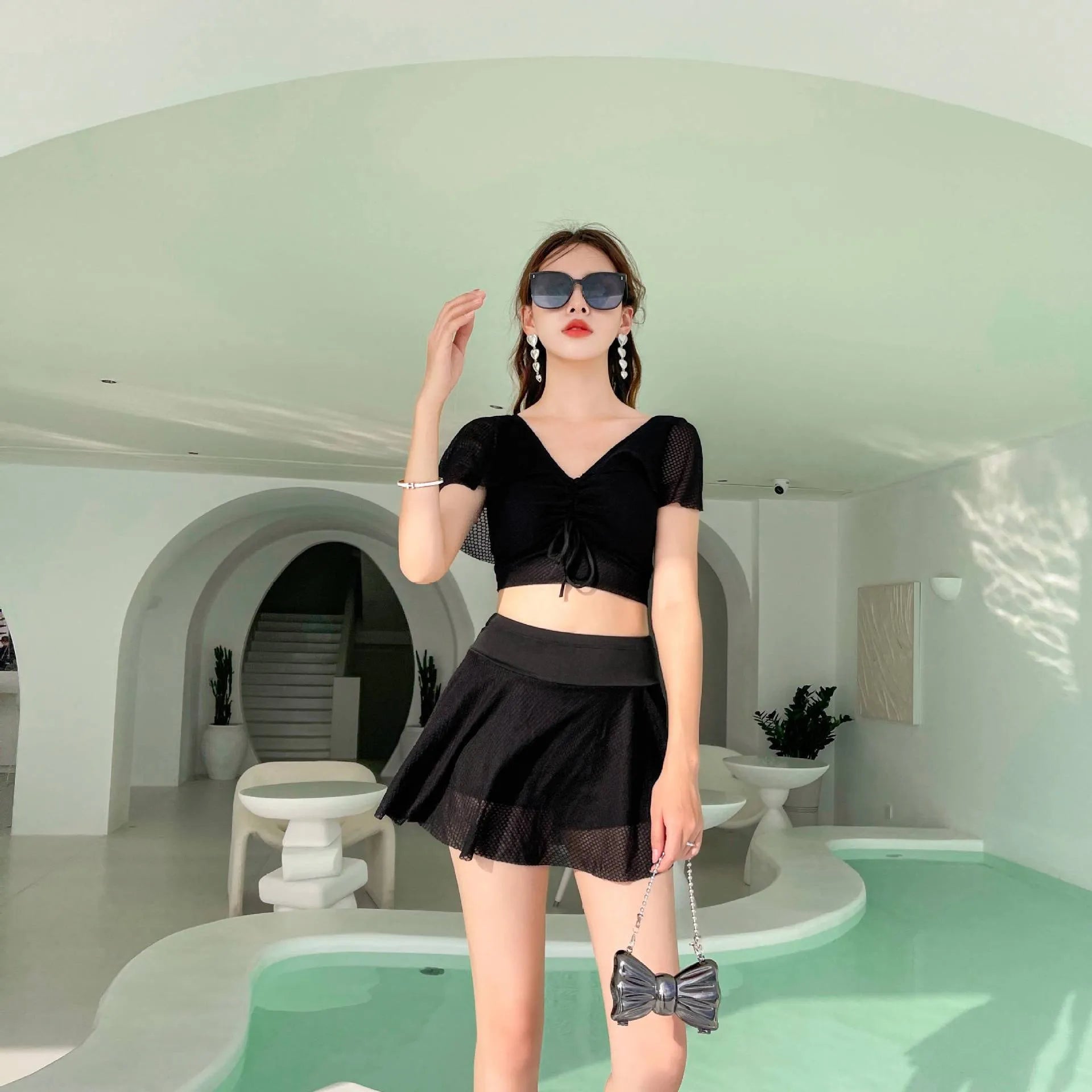 Women's two-piece skirt swimsuit in solid colour with separate top and skirt components