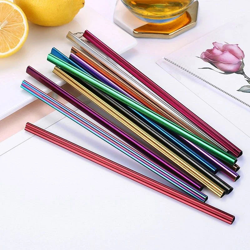 Reusable heart-shaped stainless steel straws in various colours with cleaning brush
