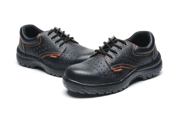 Black embossed cowhide safety shoes with steel toe cap and antiskid outsole on concrete floor