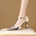 Gold women's pointed toe leather sandals with hollowed openwork design on upper.