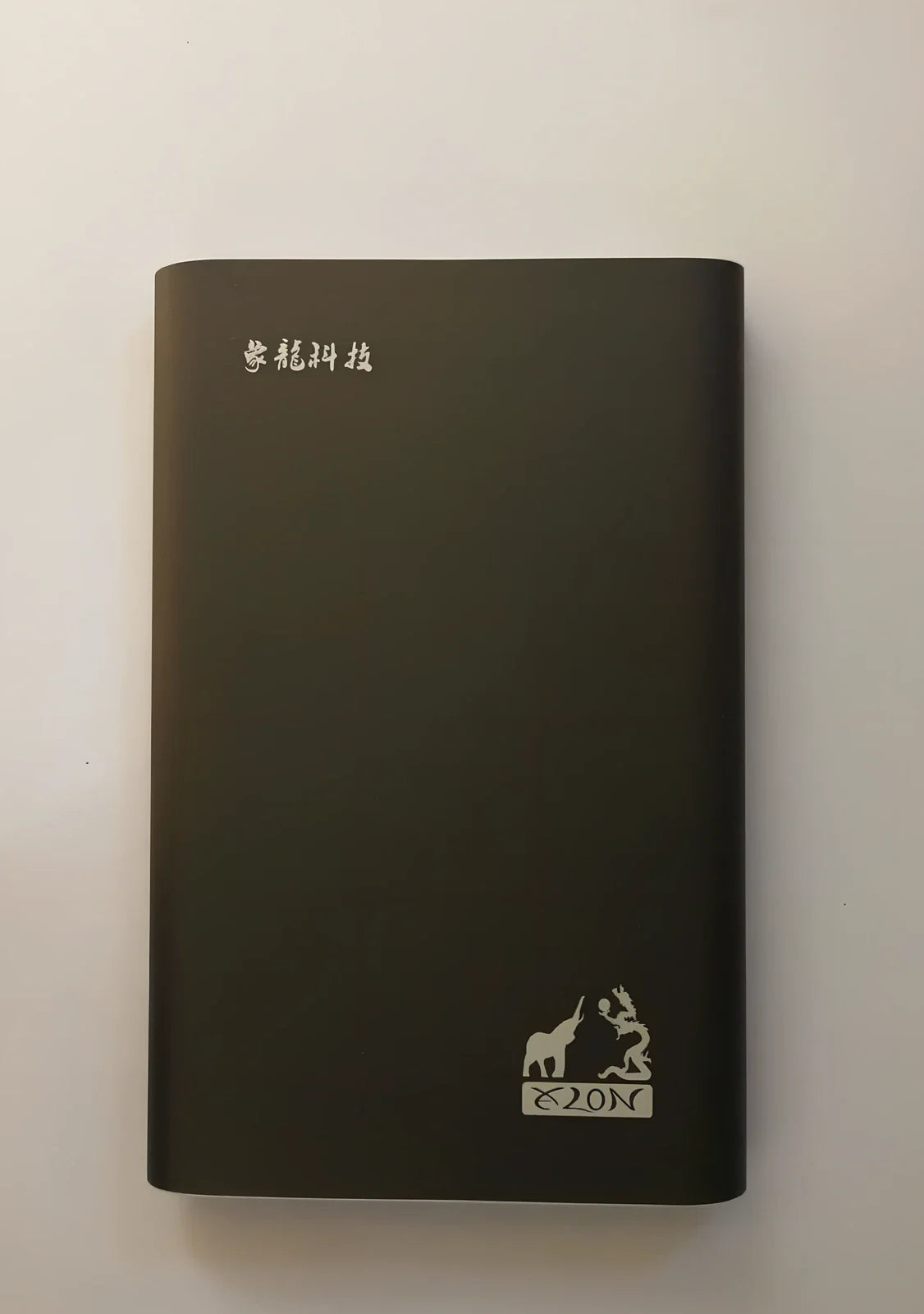 Black and silver 2.5-inch metal mobile hard drive with USB 3.0 connector showing activity light