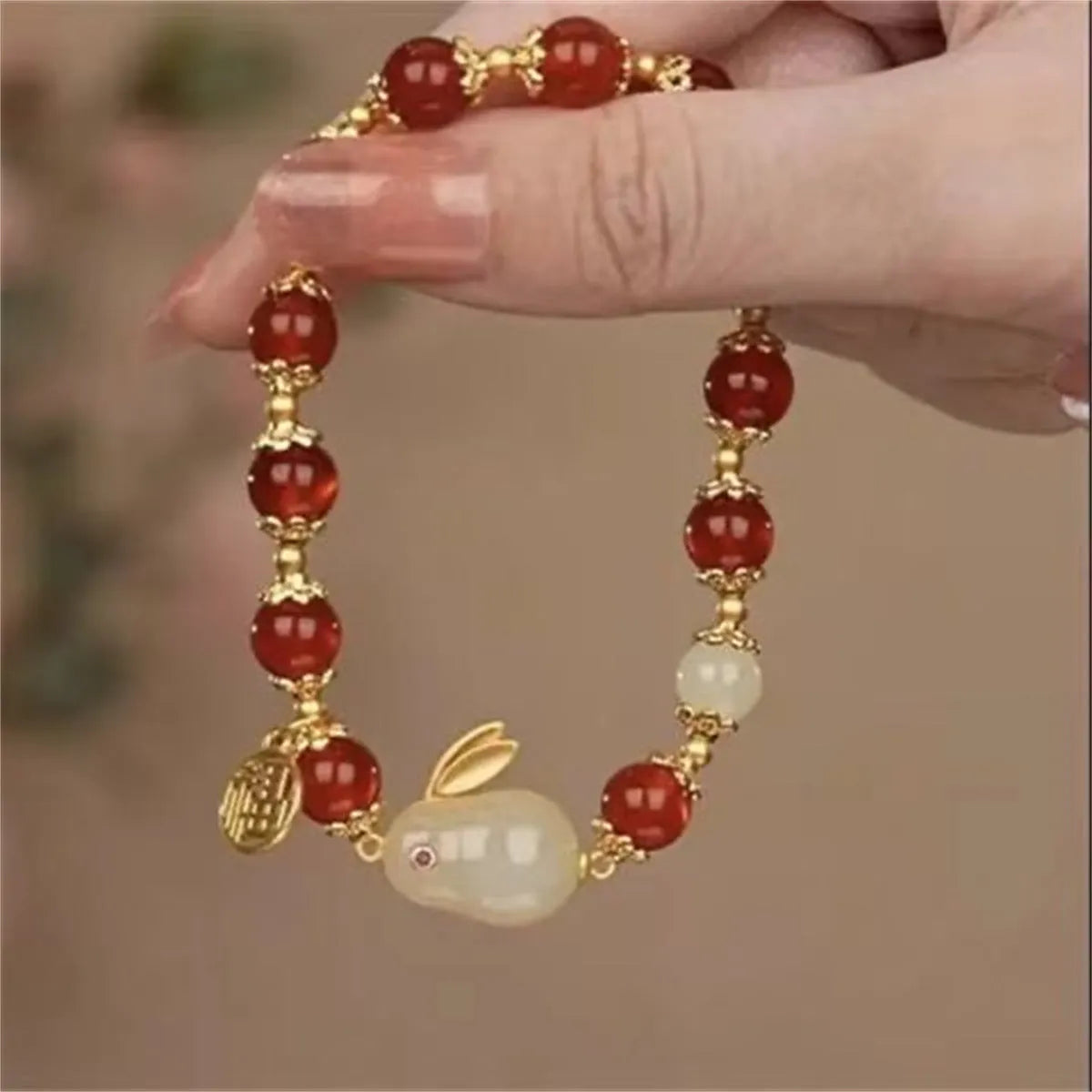 National style bracelet with rabbit charm, coloured glaze and glass beads, peace buckle clasp