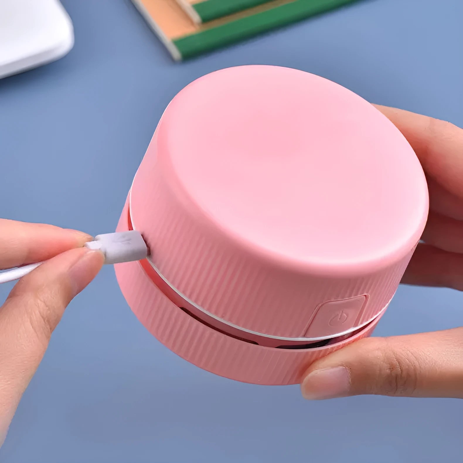 Blue portable mini handheld desktop vacuum cleaner with dust box for eraser chips.