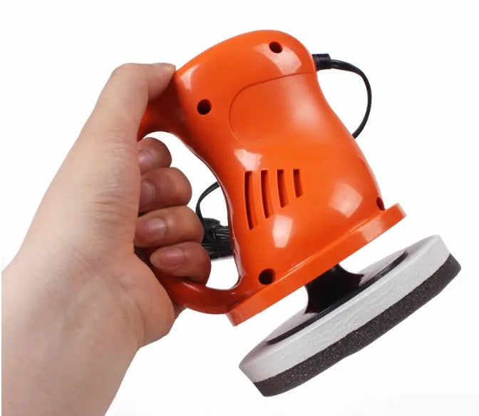 Black 12V car waxing glaze polishing machine with orange switch handle on white background