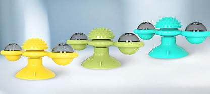 Yellow windmill cat toy with suction base, 158x74x69mm, transparent bins for balls, spinning blades and furry attachment