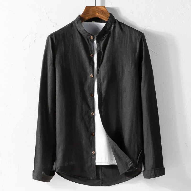 White long sleeve cotton shirt with classic fit, collared neckline, and button front