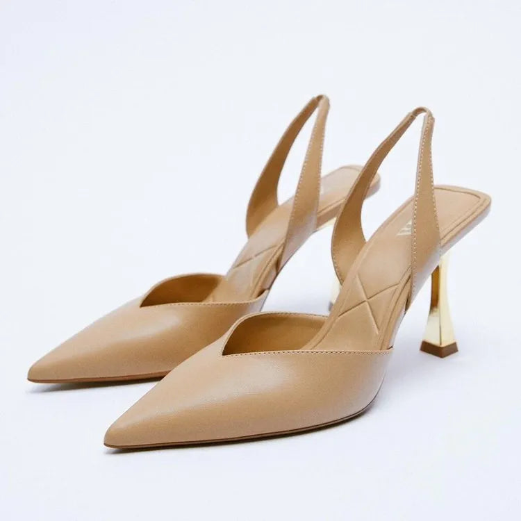 Women's pointed toe high heels in apricot colour with a shallow mouth design and glossy patent leather upper.