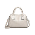 Simple large capacity women's shoulder bag in a neutral colour with internal phone and document pockets.