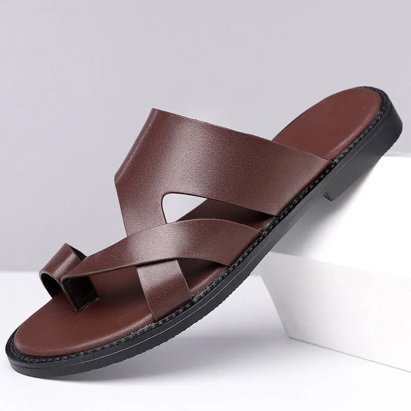 Simple Leisure Seaside Beach Slippers in dark brown with rubber sole, side view on sand