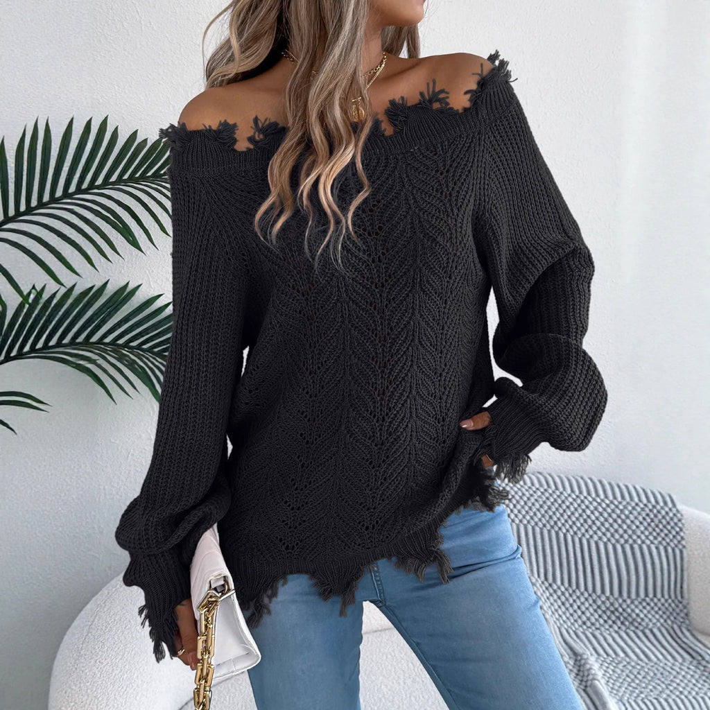 White cut-off shoulder pullover sweater with hollow-out detailing and long sleeves.