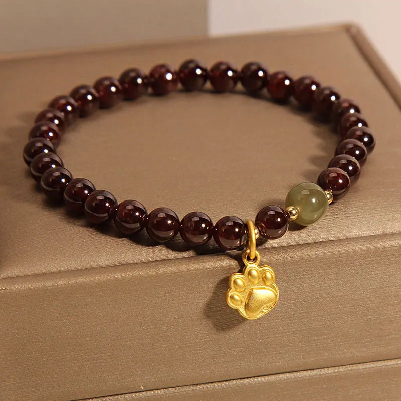 Women's adjustable crystal bracelet with Cat's Paw garnet colouration and original design