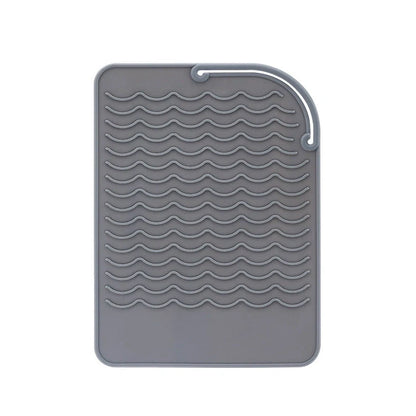 Silicone heat-proof mat for hair styling tools in pink, green, dark blue, or grey