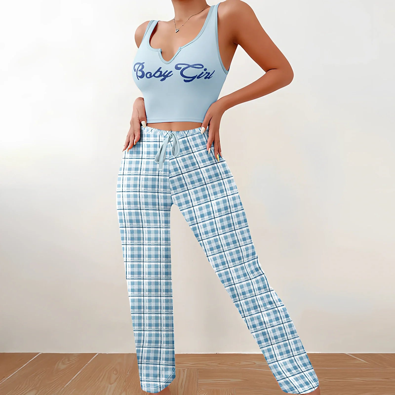 Women's plaid pyjama set with sleeveless letter print top and coordinating trousers for versatile homewear