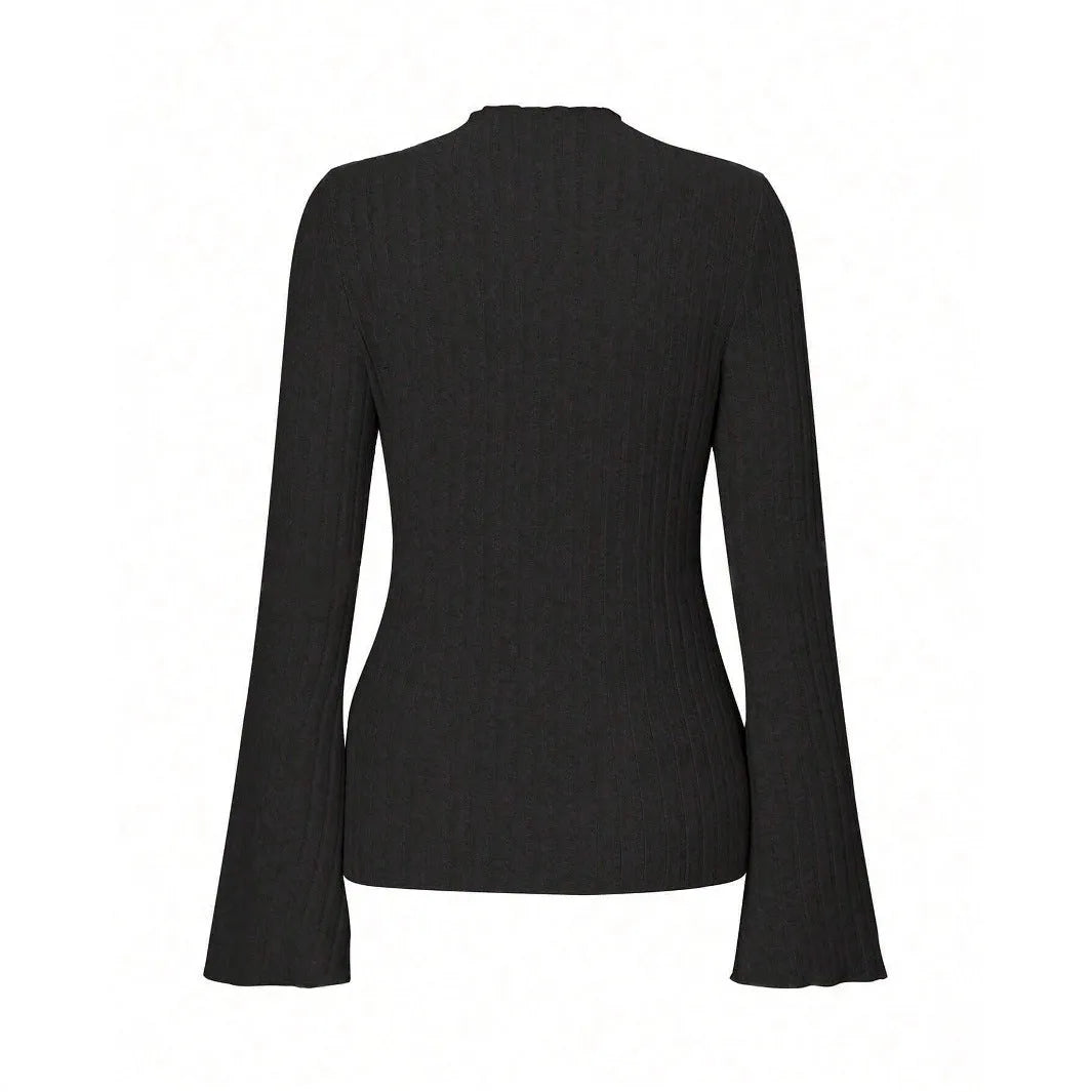 Man wearing a black slim-fit long sleeve top with lantern sleeves and a subtle stripe pattern.