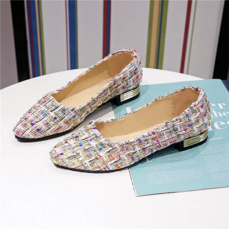Women's black and white canvas casual shoes with pointed toe and flat rubber sole