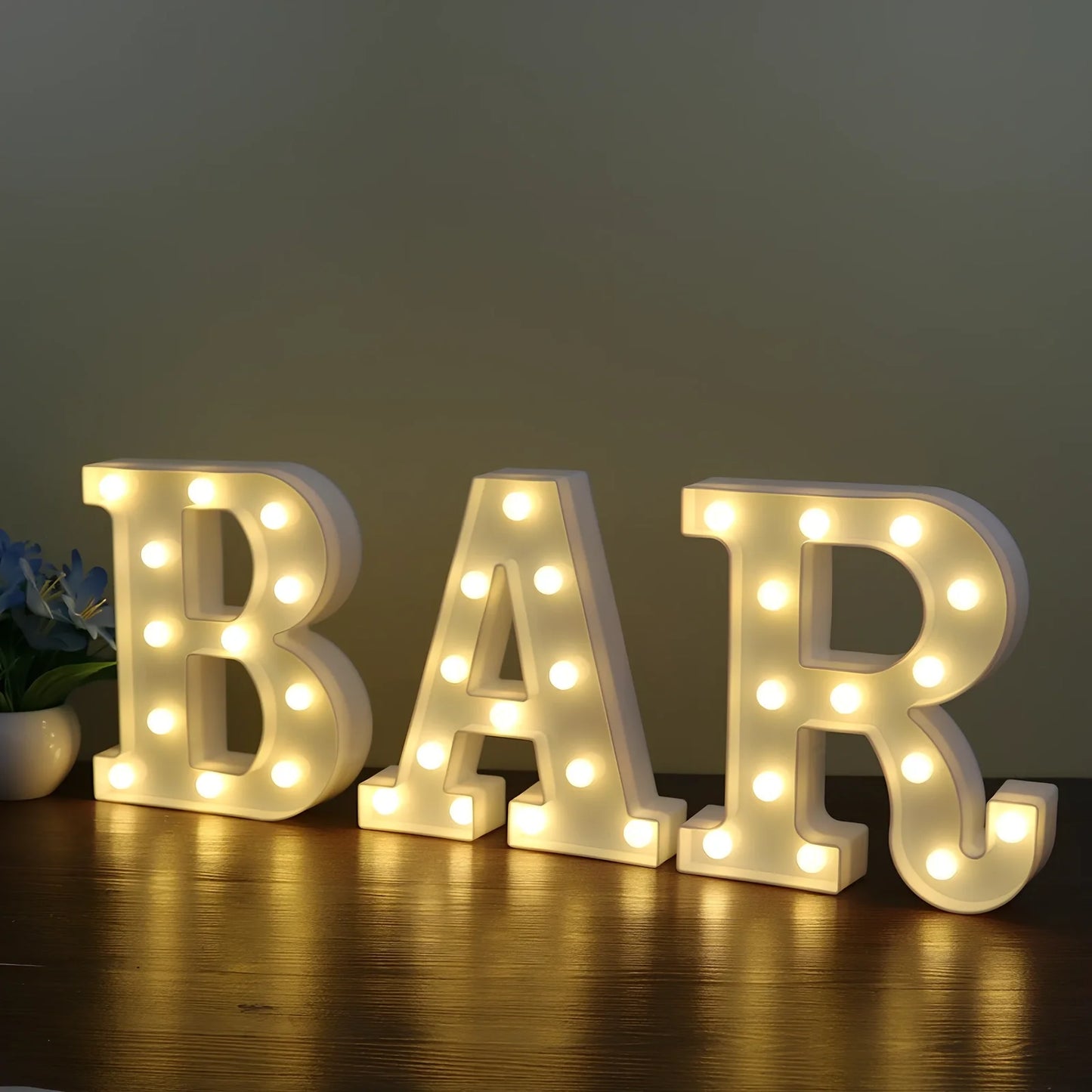 White plastic LED alphabet marquee sign with warm white illumination, 22cm height with battery operation