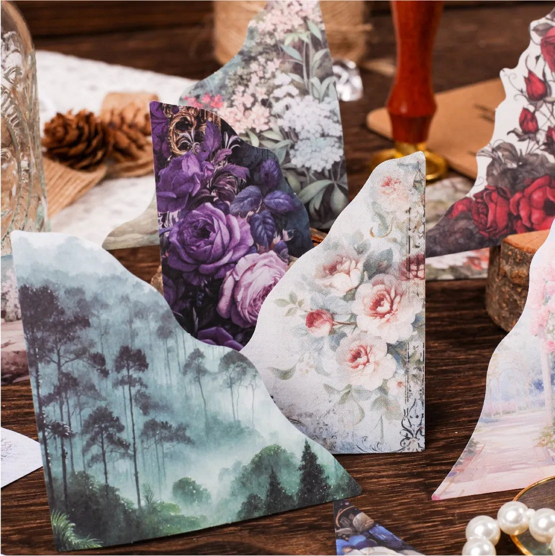 Pack of printed paper notecards in six colours showing spring vine, pink plum, red rose, blue, green wild, and purple dew designs.