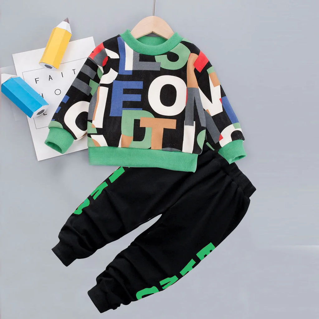 Green children's two-piece cartoon sweater suit with long sleeves and trousers on a child