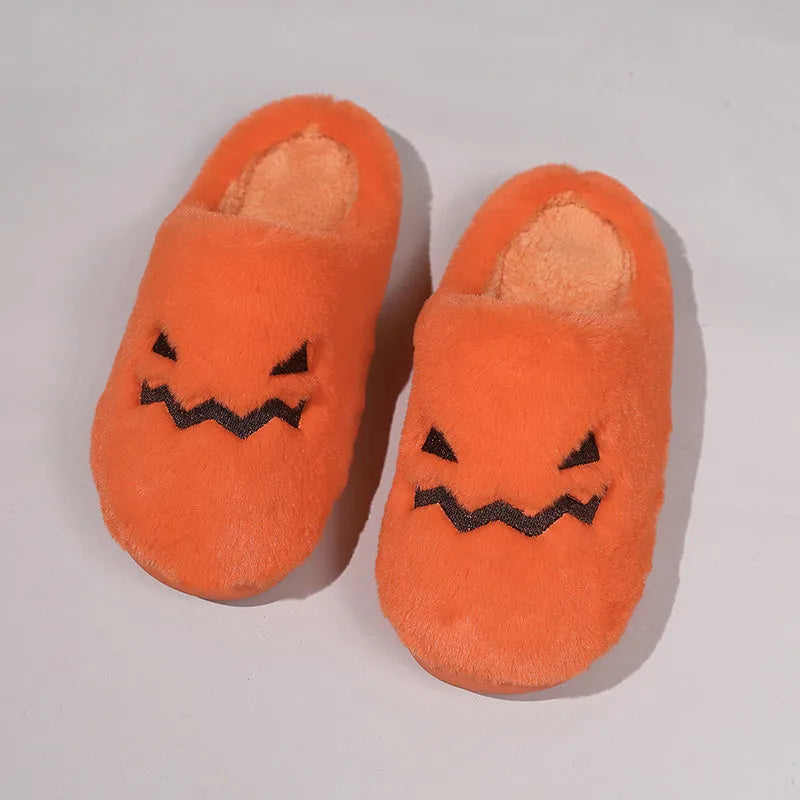 Orange Halloween pumpkin slippers with plush interior and non-slip PVC sole
