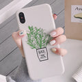White silicone iPhone case with painted plant pattern design showing 360-degree edge protection