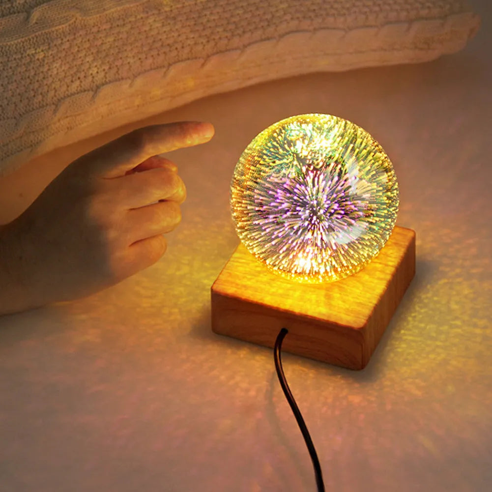 Spherical USB touch control LED night light showing starry sky pattern on a desk.