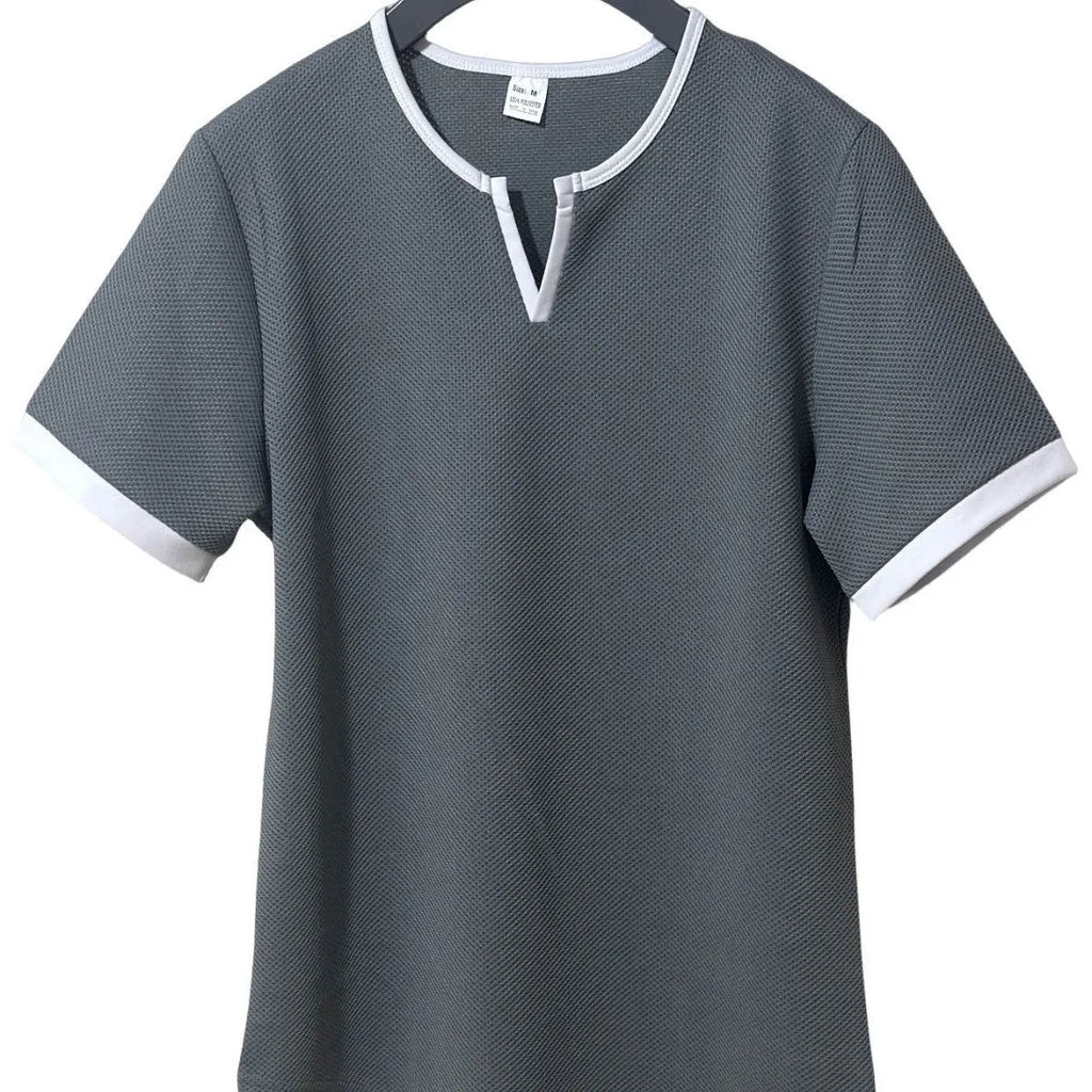 Colour-block V-neck sports t-shirt in waffle-knit polyester fabric on a hanger.