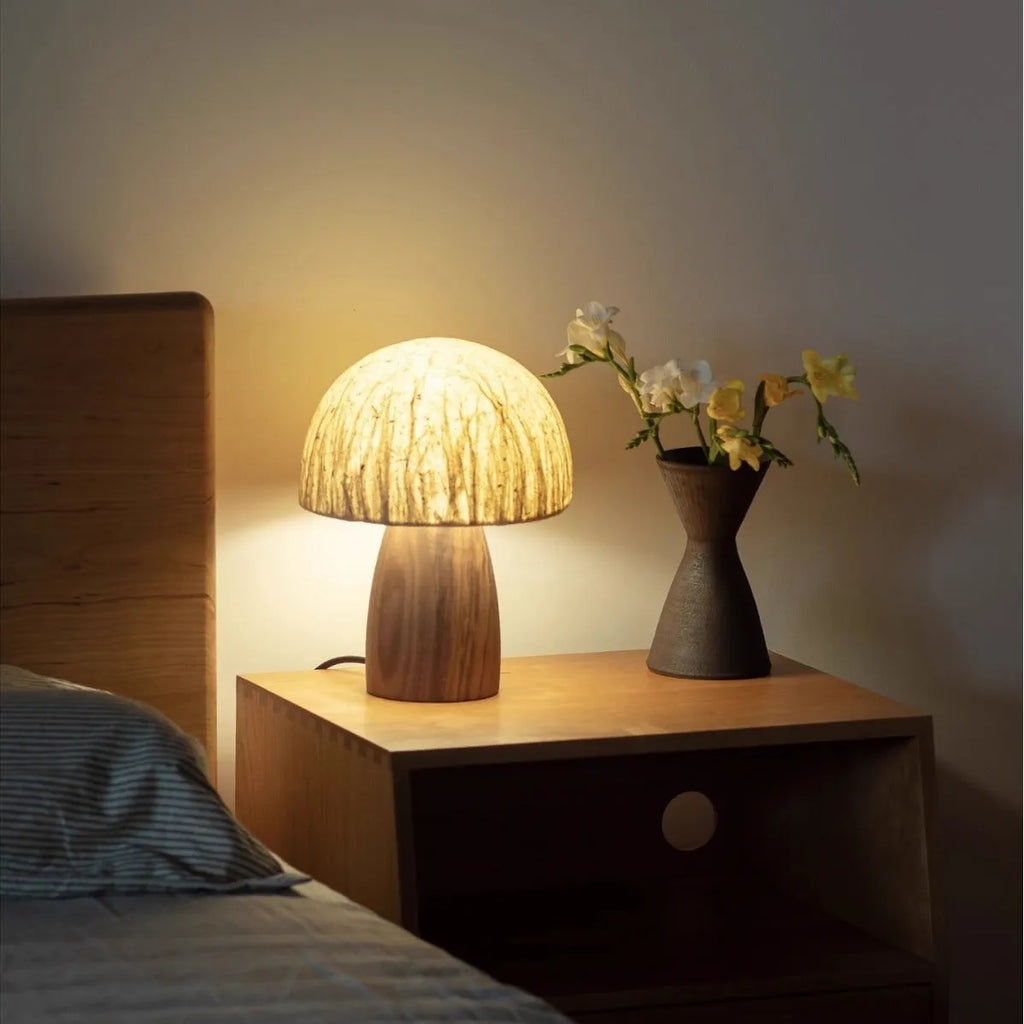 Handmade black walnut mushroom lamp with Japanese style ambient glow on tabletop