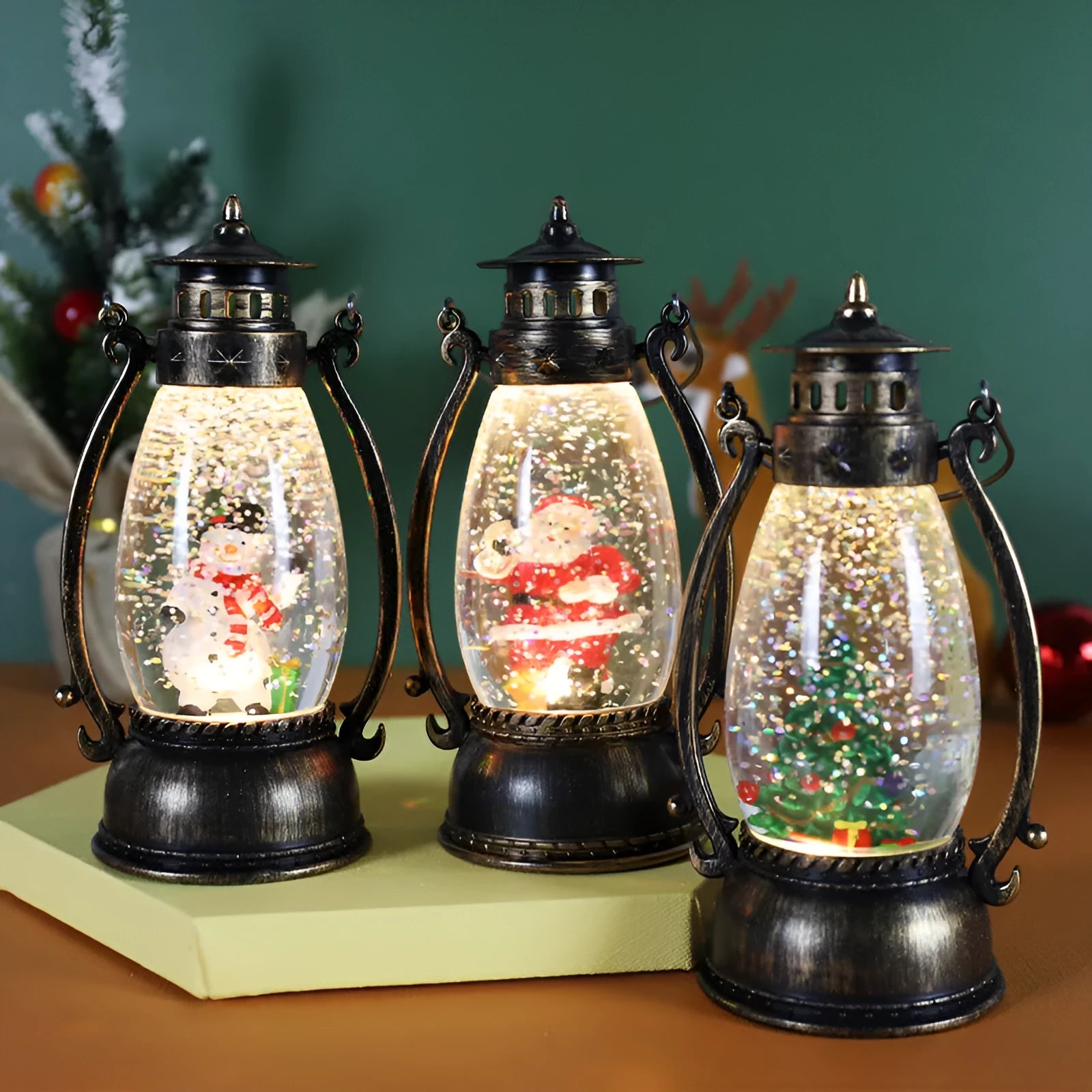 Plastic crystal ball LED oil lamp Christmas ornament with snowman or elderly design on desktop.