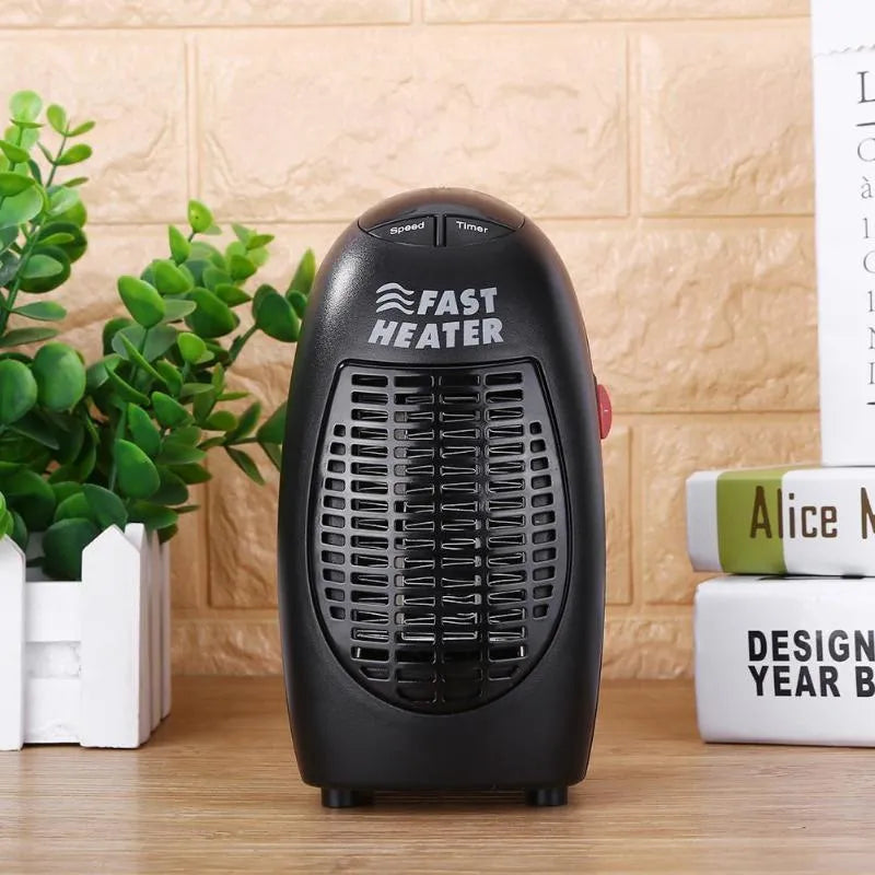 Black mini portable electric heater with digital display and a rotating three-prong plug.