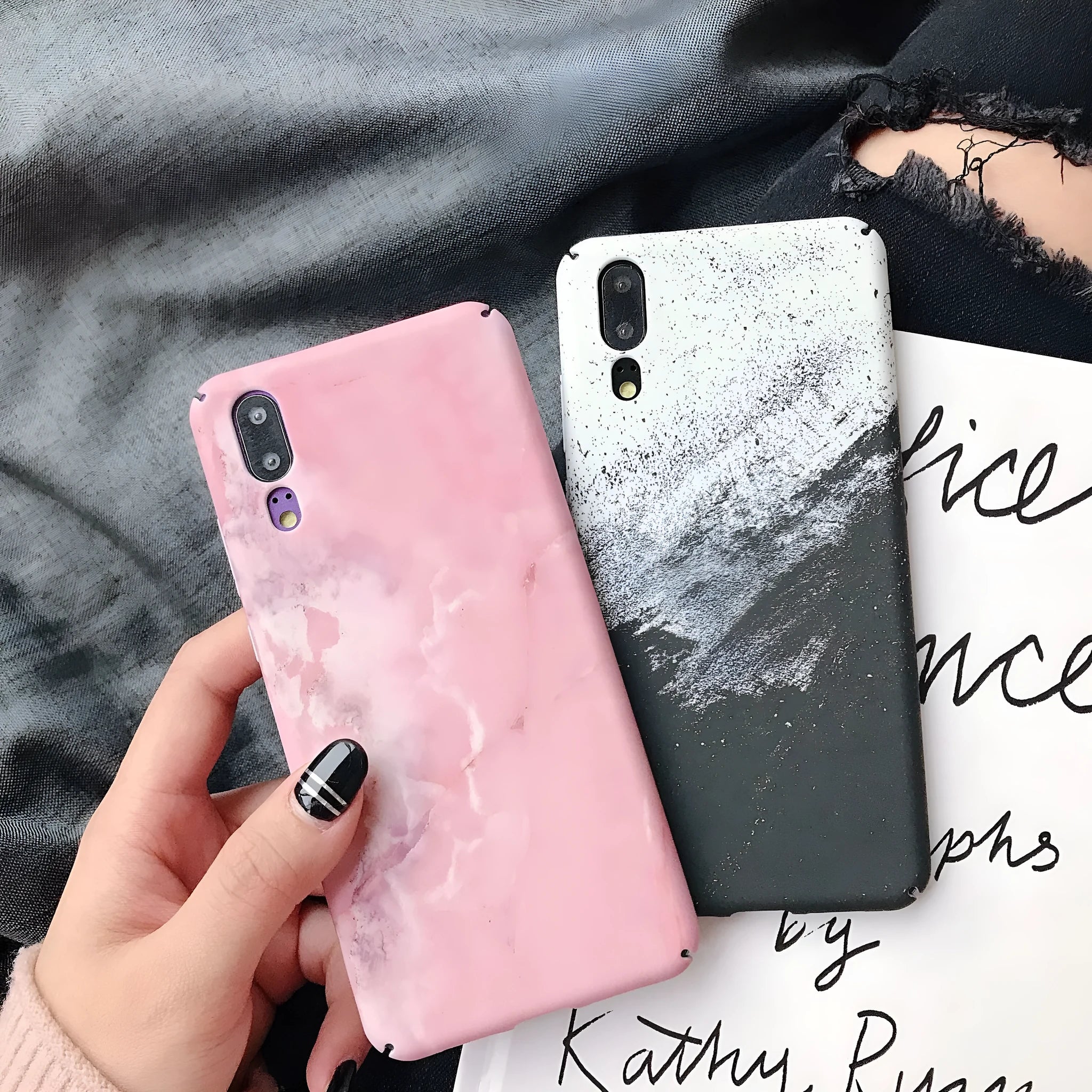 Solid black and solid pink painted phone back covers for Huawei and Honor smartphones on a white background.