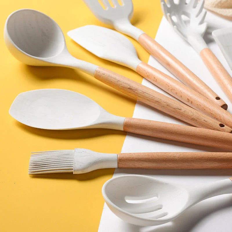 Elegant marbled silicone kitchenware set with wooden handle, perfect for cooking and baking.
