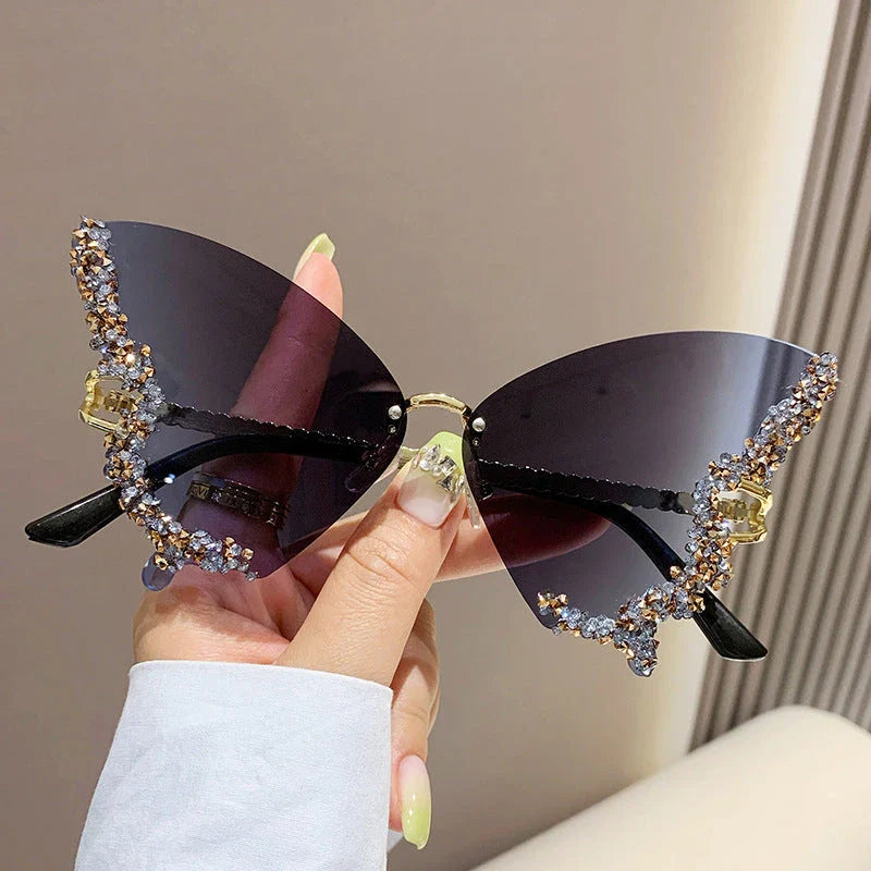 Luxury diamond-studded butterfly sunglasses in various gradient color options, featuring a vintage-inspired design and high-quality materials for a fashionable and glamorous look.