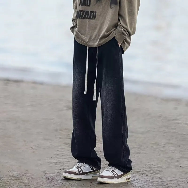 Men's straight-leg jeans in blue with drawstring waist and loose fit casual style
