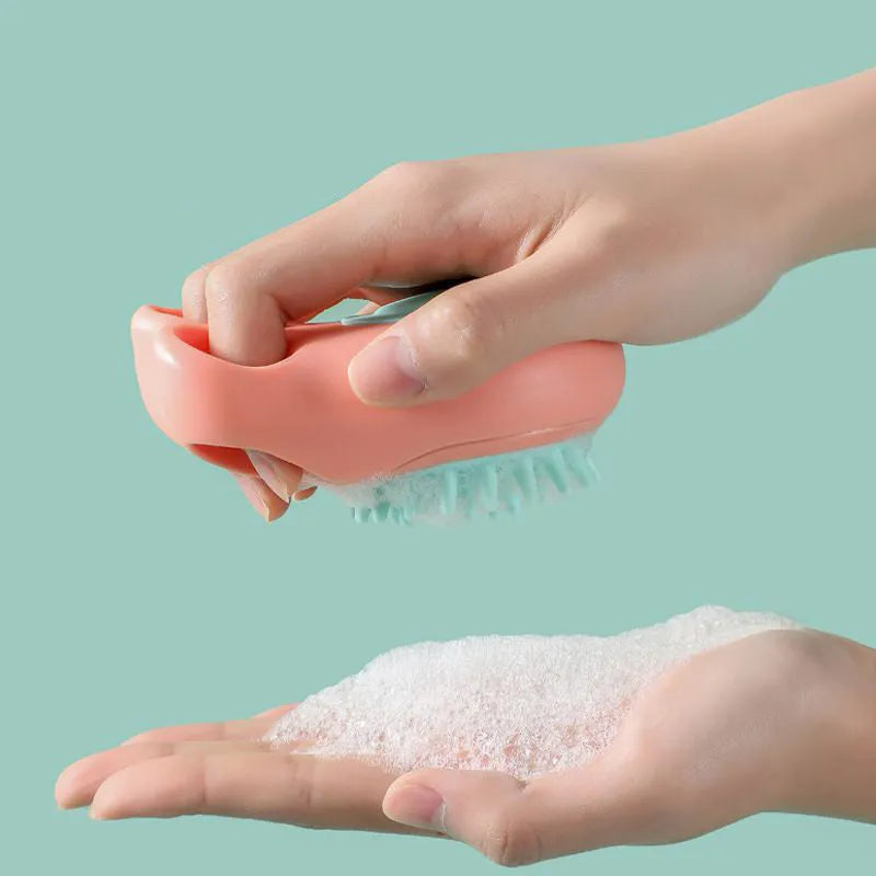 Cat claw-shaped silicone pet bath brush with suction cup base, shown in blue colour.