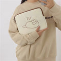 Nylon tablet protective sleeve with embroidered cat design and zip opening.