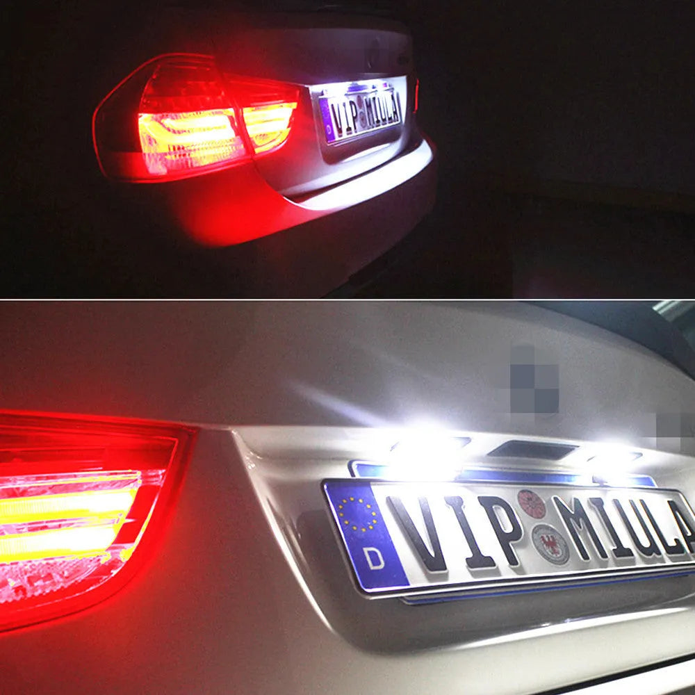 Two Volkswagen LED license plate light bulbs with white LEDs and electrical connectors.