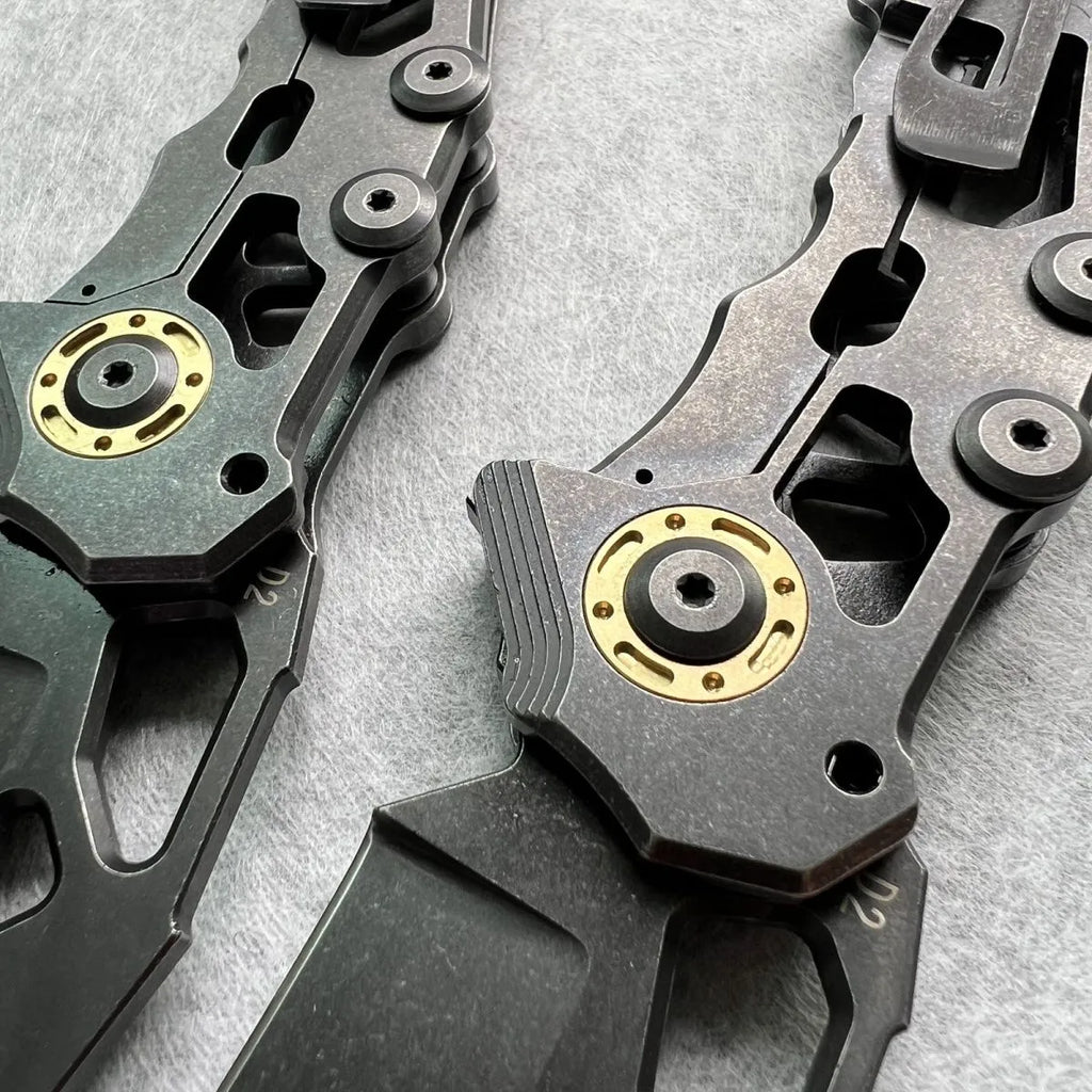 D2 steel folding knife with 9cm blade on outdoor background