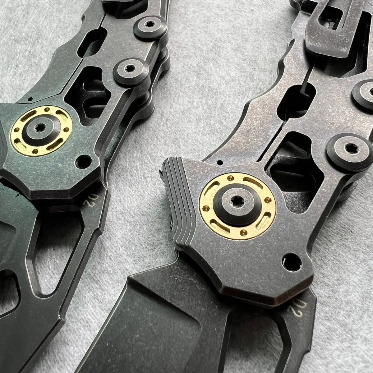 D2 steel folding knife with 9cm blade on outdoor background