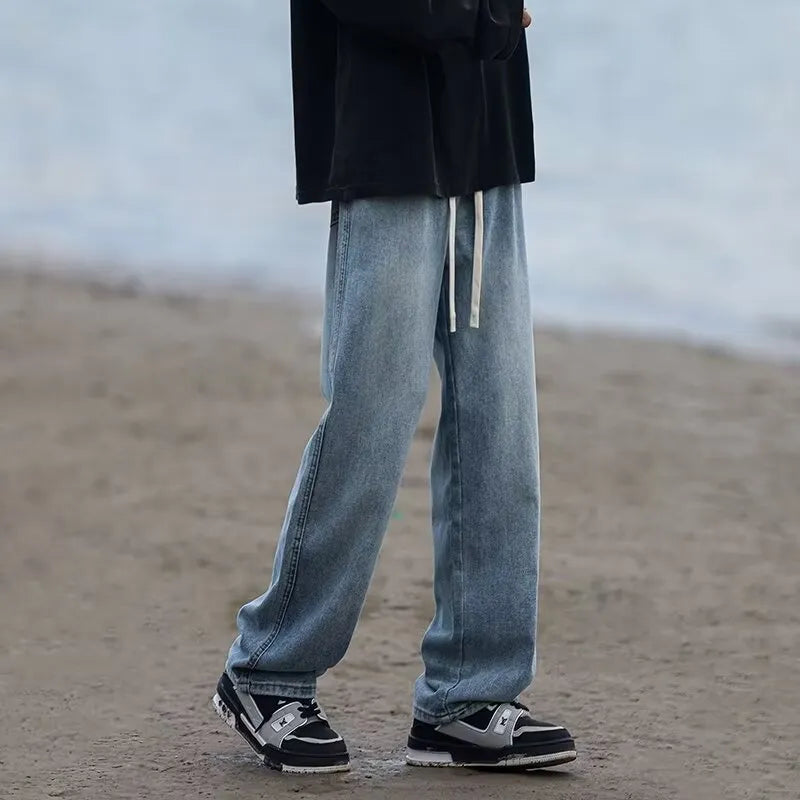 Men's straight-leg jeans in blue with drawstring waist and loose fit casual style