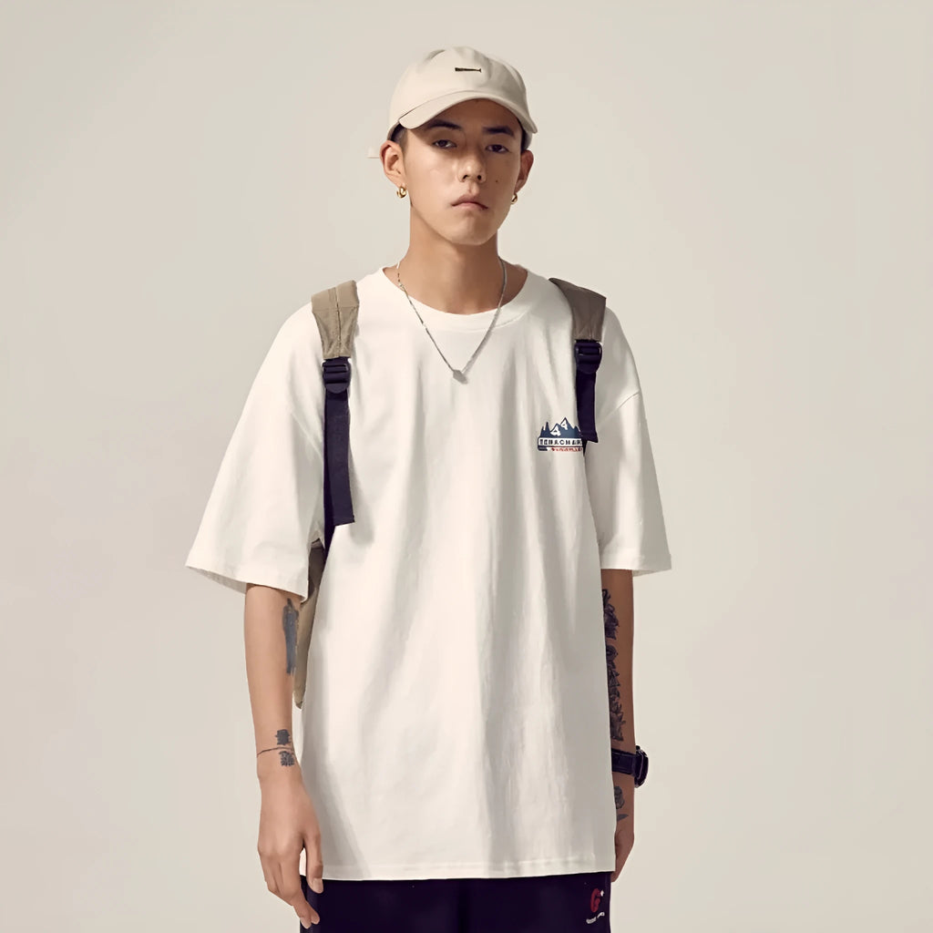 Men's loose fit plus size short-sleeved t-shirt in black, on a hanger.