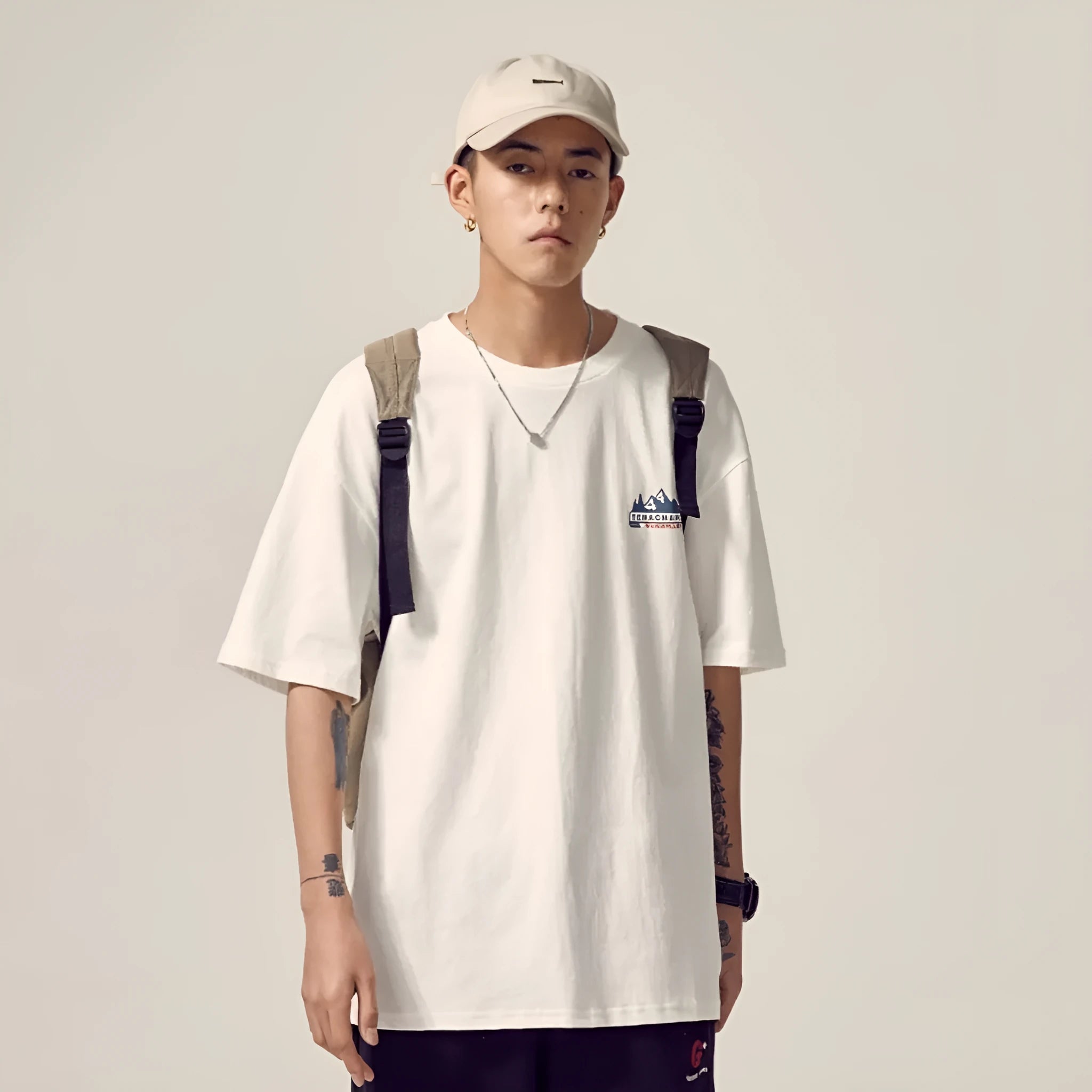 Men's loose fit plus size short-sleeved t-shirt in black, on a hanger.