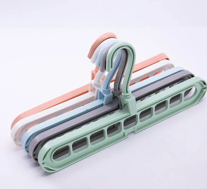 9-hole clothes hanger organizer in white, green, gray, and pink options