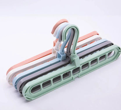 9-hole clothes hanger organizer in white, green, gray, and pink options